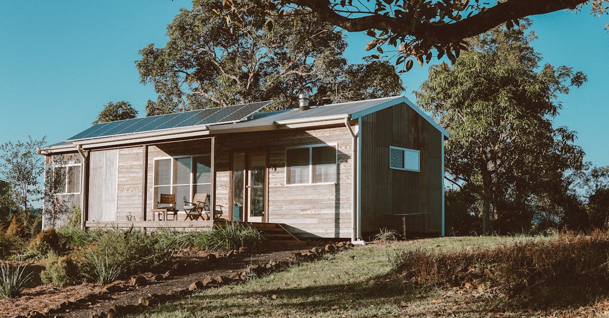 Wooden house with solar panels surrounded by greenery in Australia