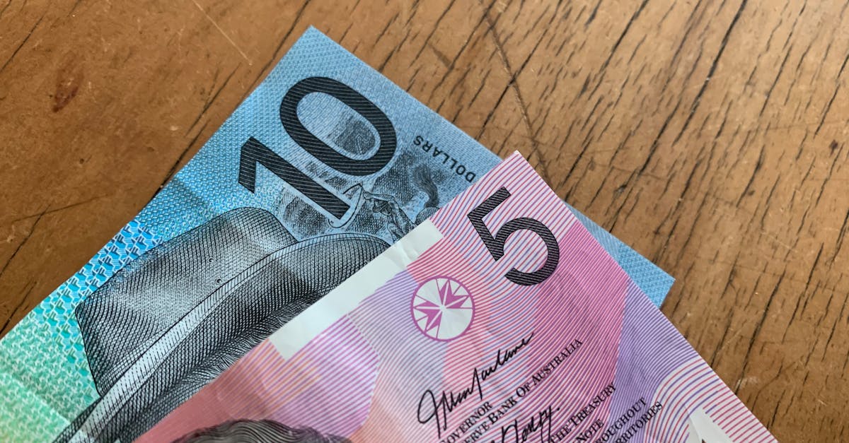 Australian dollar notes on a wooden surface