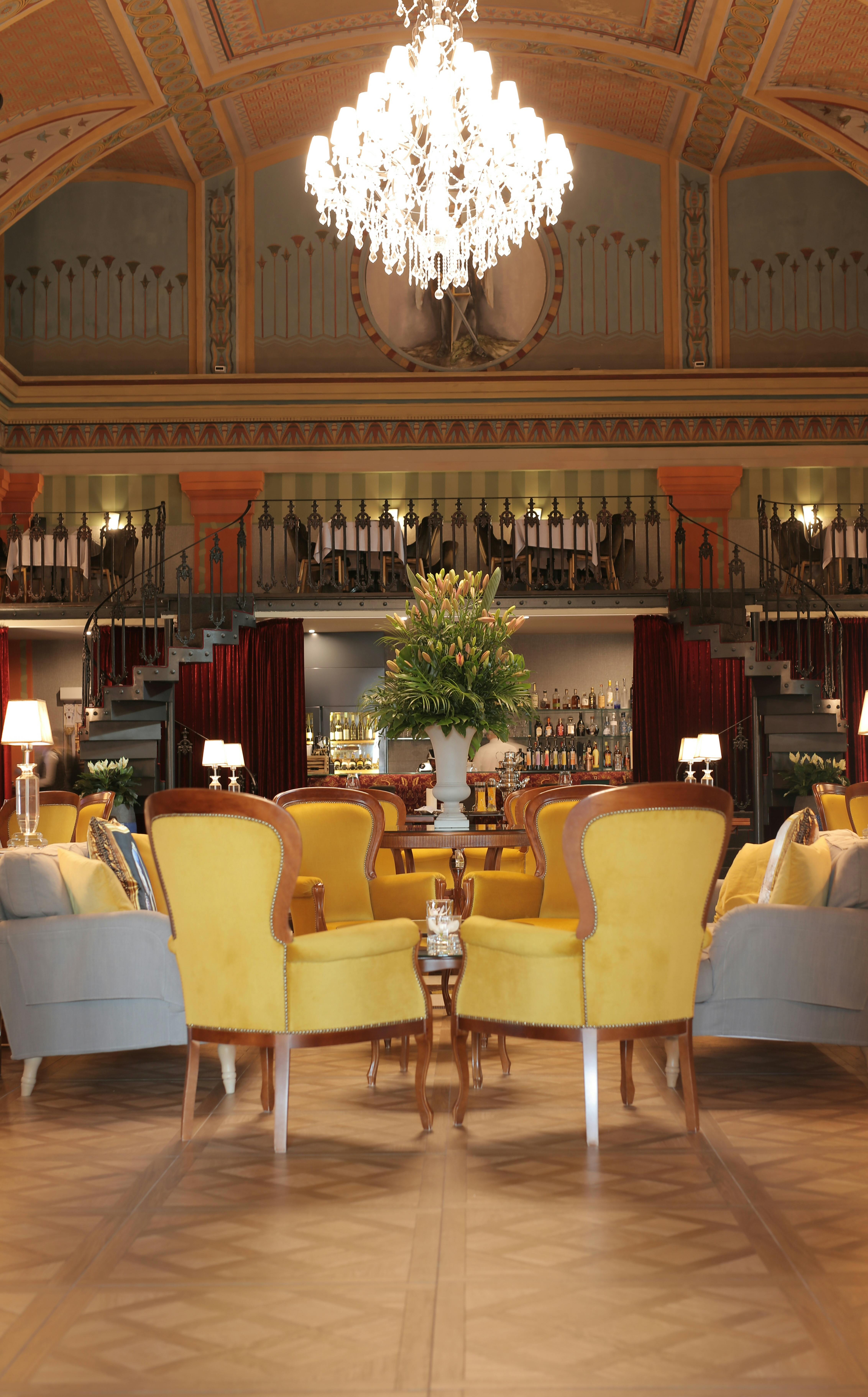 Elegant hotel lounge with vintage armchairs and warm lighting