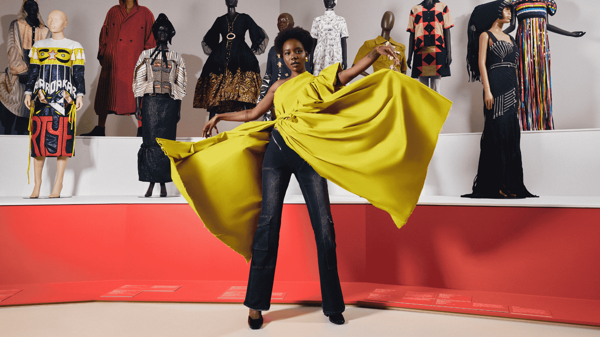 Gloria Chol in her Melbourne studio, before a rack of printed organza pieces from her Lines of Power collection